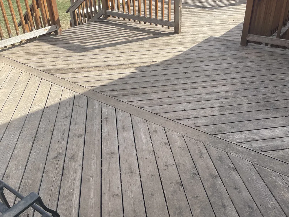 Same deck weathered and faded before staining